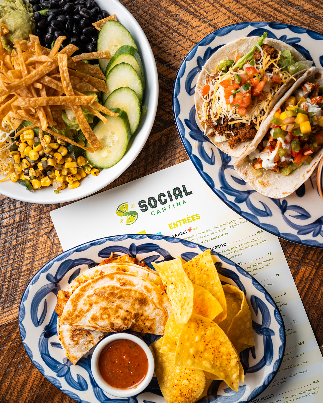 Street tacos, a quesadilla with salsa, and a taco salad bowl at Social Cantina Nashville